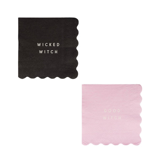 Two paper napkins, one black with 'Wicked Witch' text and one pink with 'Good Witch' text, on a white background.